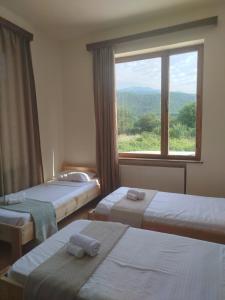 Letto o letti in una camera di Gremeli Wine & Hotel