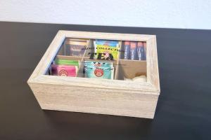 a wooden box filled with books on a table at LIME HOMES Balkon, Küche, Messe, Marienburg in Sarstedt