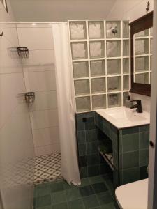 a bathroom with a sink and a shower at La madrileña 2 in Casabermeja +19 photos