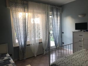TV a/nebo společenská místnost v ubytování Bed and Breakfast da Beatrice