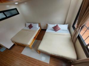Postel nebo postele na pokoji v ubytování Quarry Bay Hometel Sagada