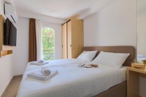 Ein Bett oder Betten in einem Zimmer der Unterkunft Hotel Delfin