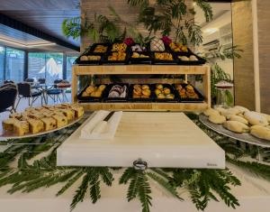 a bakery with various breads and pastries on display at Quality Gold Suite Hotel in Antalya