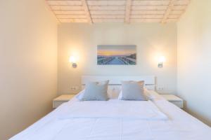 En eller flere senge i et værelse på Luv & Lee