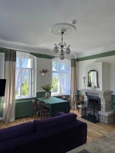 a living room with a couch and a table at Willa Świeradówka in Świeradów-Zdrój