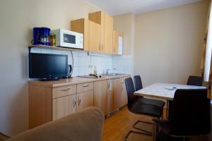 Kuchyň nebo kuchyňský kout v ubytování Appartement Alpensee