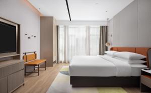 Vuode tai vuoteita majoituspaikassa Home2 by Suite Liaocheng Dongchang