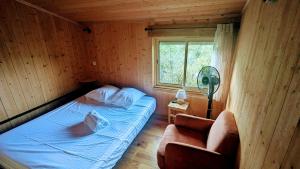 Postel nebo postele na pokoji v ubytování Cabanes et Lodges du Belvedere