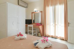 Кровать или кровати в номере Mare Hotel Apartments