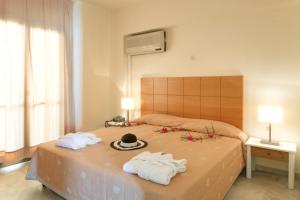 Кровать или кровати в номере Mare Hotel Apartments