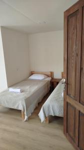 Letto o letti in una camera di Gremeli Wine & Hotel