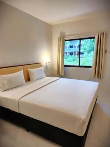 Postel nebo postele na pokoji v ubytování PS 2 Resort Phuket Patong - SHA Plus