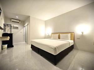 Postel nebo postele na pokoji v ubytování PS 2 Resort Phuket Patong - SHA Plus