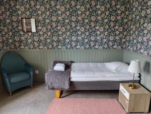 Säng eller sängar i ett rum på Brunnsvik Hotell & Konferens