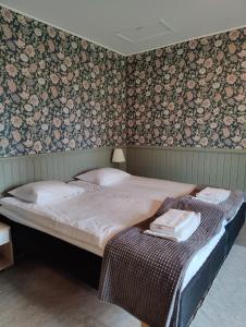 Säng eller sängar i ett rum på Brunnsvik Hotell & Konferens