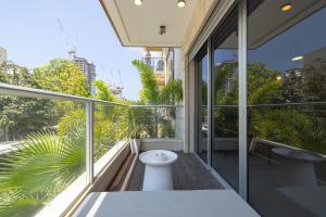 a toilet on the balcony of a building at The Shoreline By Localz - Beach Complex in Tel Aviv