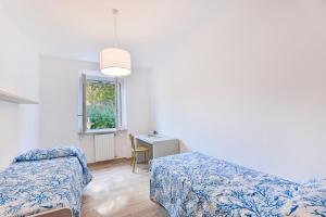 Ένα ή περισσότερα κρεβάτια σε δωμάτιο στο Casa G un Giardino su Portoferraio