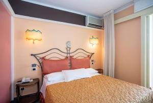 Кровать или кровати в номере Hotel Barcarola 2