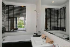 a white bathroom with a tub and a sink and a bath tub at Апартаменты с видом на море на Карон Бич А 409 in Karon Beach