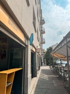 a building with tables and chairs on a street at Luxury Design Apartments - Poznańska Warsaw City Center in Warsaw +26 photos