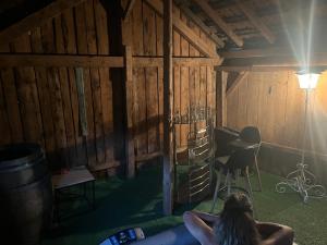 a woman laying on the floor in a barn at gite du Breuchin in La Longine