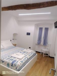 Ένα ή περισσότερα κρεβάτια σε δωμάτιο στο La casa del nonno Berto +21 φωτογραφίες