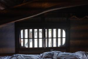 Letto o letti in una camera di 篠山城下町ゲストハウス quolo