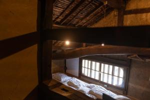 Letto o letti in una camera di 篠山城下町ゲストハウス quolo