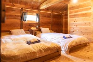 Letto o letti in una camera di 篠山城下町ゲストハウス quolo