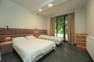 Postel nebo postele na pokoji v ubytování Villa Ipanema