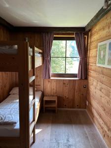 Rúm í herbergi á Fleissner Hütte