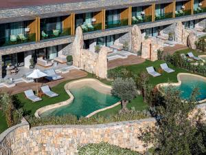an aerial view of a hotel with a swimming pool at Lujo Hotel Bodrum in Guvercinlik