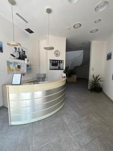 a lobby with a reception desk and a counter at Apartament Residence Nysa in Nysa