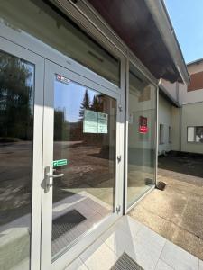 an entrance to a building with sliding glass doors at Apartament Residence Nysa in Nysa