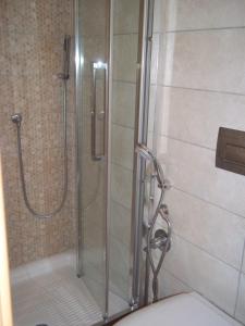 a shower in a bathroom with a glass shower stall at Il Pretoriano in Rome