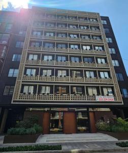 a tall building with a lot of windows at Art Homes 85 in Bogotá