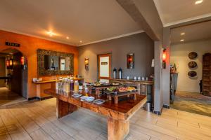 a room with a table with food on it at Singa Lodge - Lion Roars Hotels & Lodges in Port Elizabeth