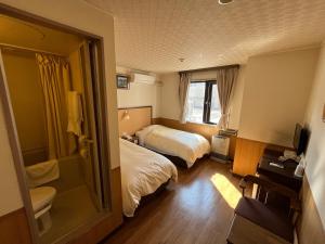 Ein Bett oder Betten in einem Zimmer der Unterkunft Hotel Marsh Land