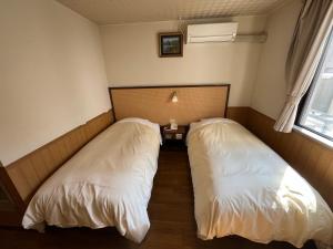 Ein Bett oder Betten in einem Zimmer der Unterkunft Hotel Marsh Land