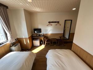 Ein Bett oder Betten in einem Zimmer der Unterkunft Hotel Marsh Land