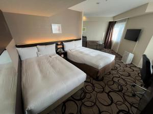 Ein Bett oder Betten in einem Zimmer der Unterkunft Hotel Marsh Land