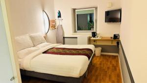Postel nebo postele na pokoji v ubytování Cambridge Hotel Bradford Central