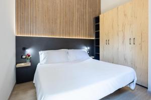 Cama ou camas em um quarto em Villaggio Miramare