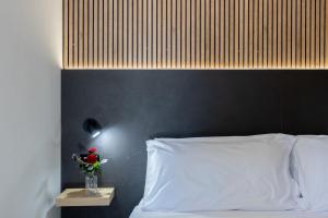 Cama ou camas em um quarto em Villaggio Miramare