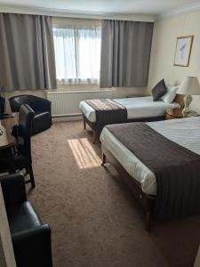 Postel nebo postele na pokoji v ubytování Britannia Hotel Aberdeen