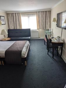 Postel nebo postele na pokoji v ubytování Britannia Hotel Aberdeen