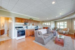 a kitchen and living room with a couch and a table at Holmes With a View Studio Millersburg Retreat! in Millersburg