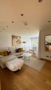a living room with a couch and a table at Myrtle Bank Guest House in Fort William