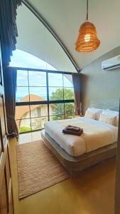 Postel nebo postele na pokoji v ubytování Villa La Quartz Seaview 2BR
