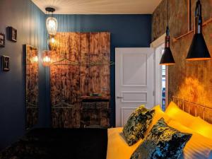 a bedroom with a bed with yellow pillows at Boutique City Centre Flat by City SuperHost in Manchester